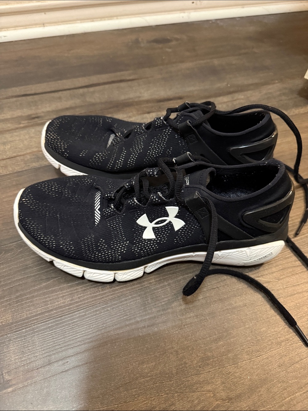 Under Armour Women’s Black and White Athletic Running Shoes